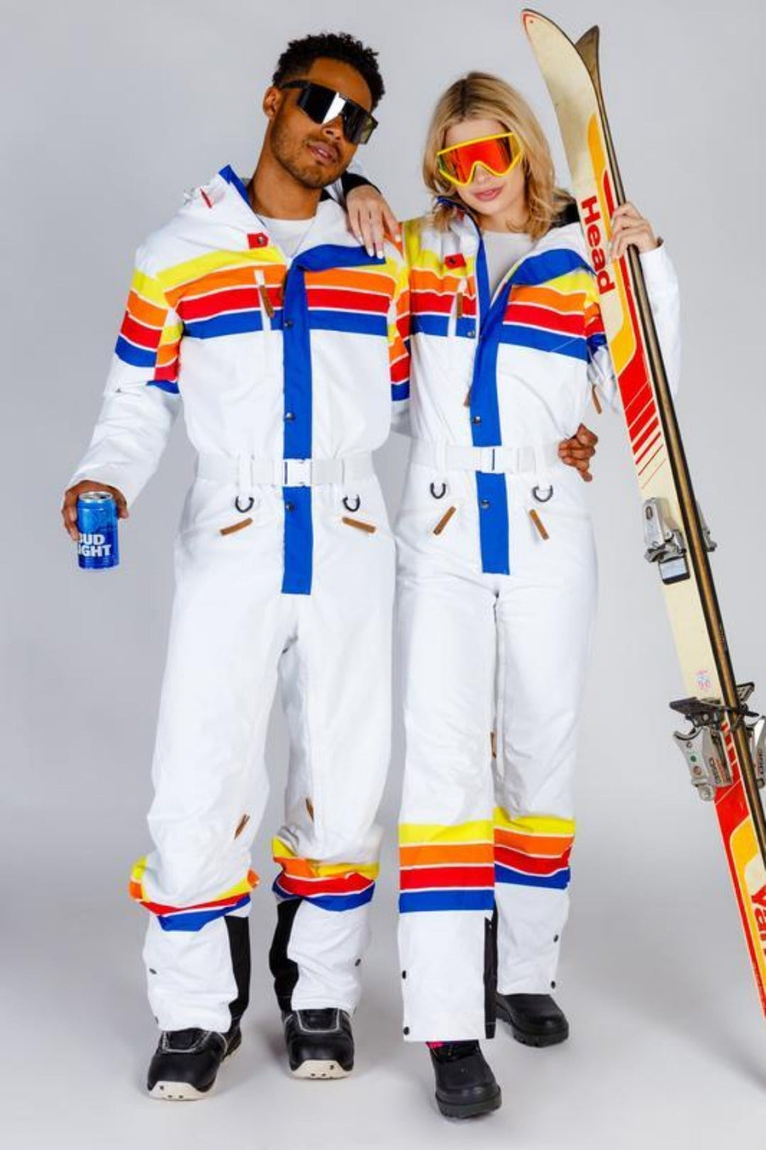 white ski suit multi coloured stripes couples matching onepiece